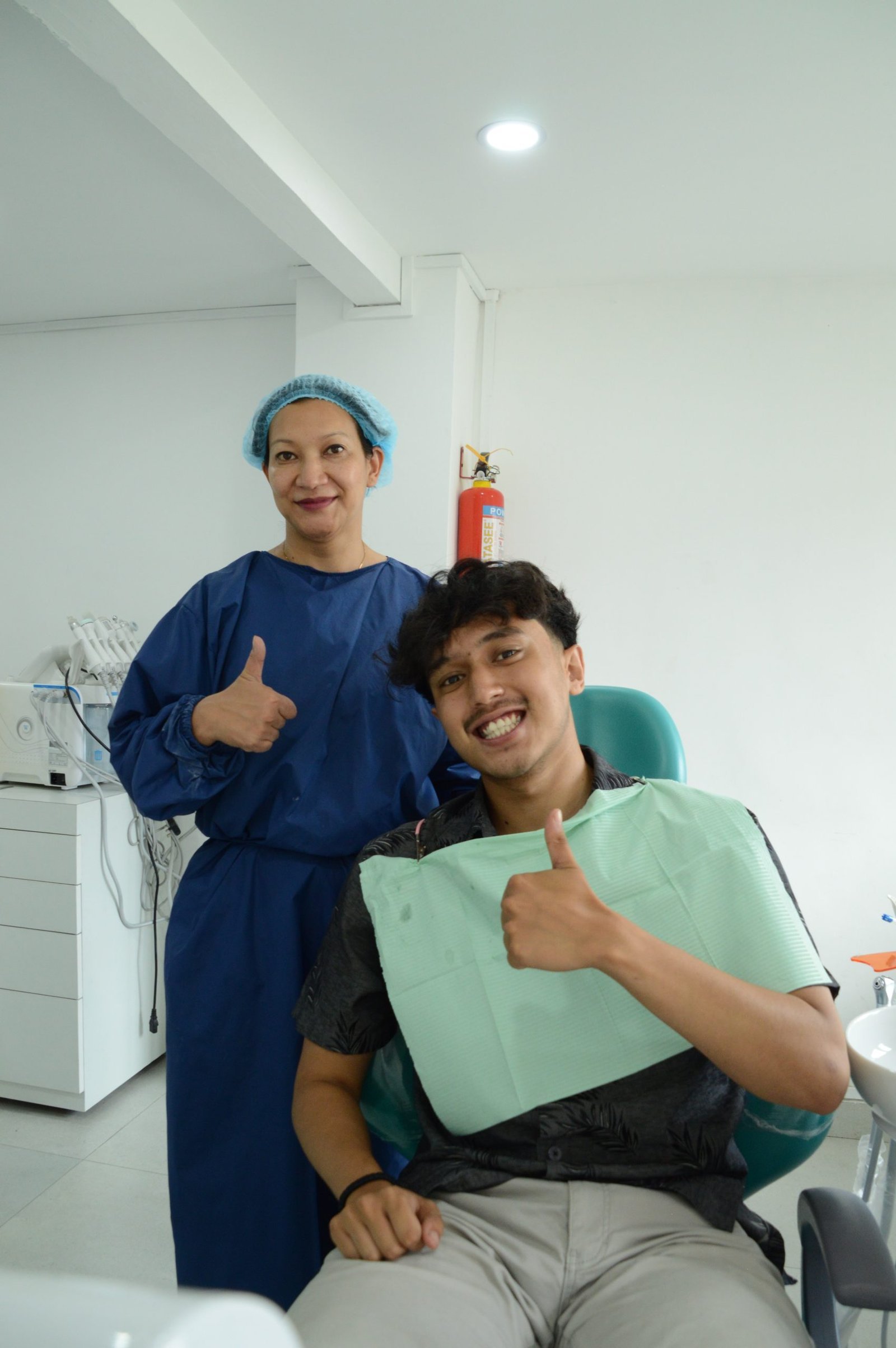 Dr. Deepti with happy patient in dental chair